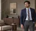 Winter fashion outfit with a navy blazer, pale blue shirt and navy tie featuring gold floral motifs
